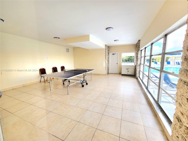 game room featuring light tile floors