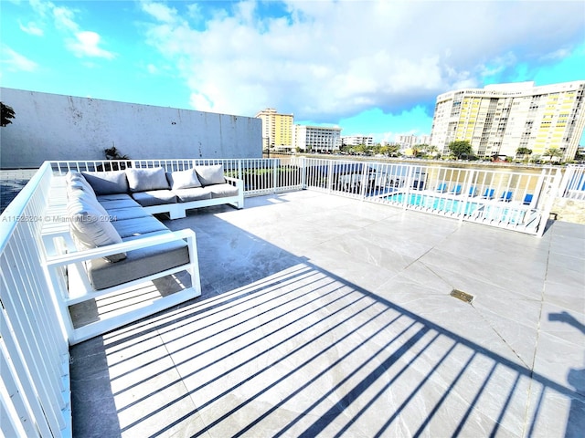 view of patio / terrace featuring outdoor lounge area and a community pool