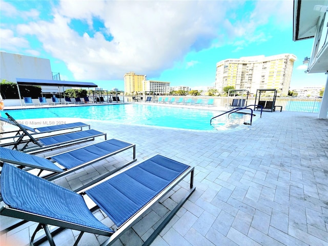 view of swimming pool with a patio area