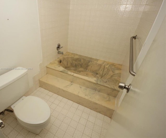 bathroom featuring toilet and tile flooring