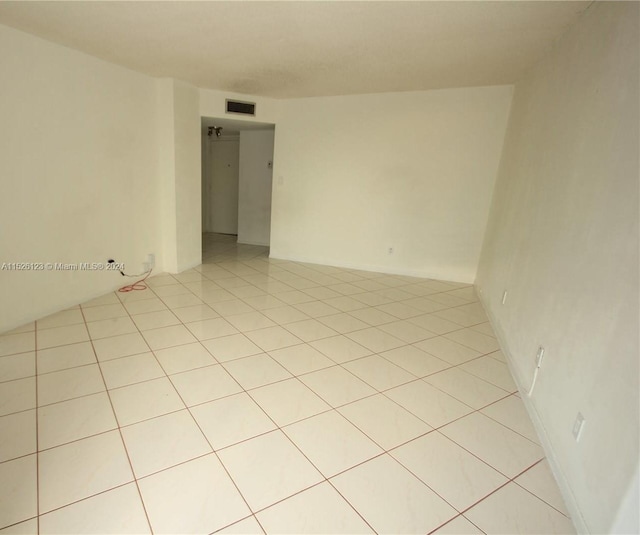 empty room with light tile floors