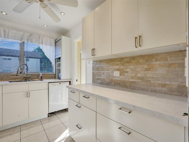 kitchen with ceiling fan, sink, light tile floors, dishwasher, and backsplash