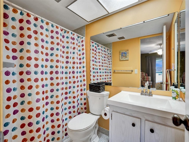 bathroom featuring toilet and vanity