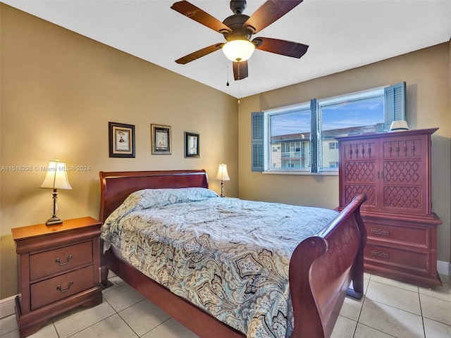 tiled bedroom with ceiling fan