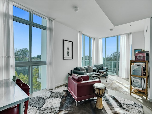 living room with plenty of natural light and floor to ceiling windows