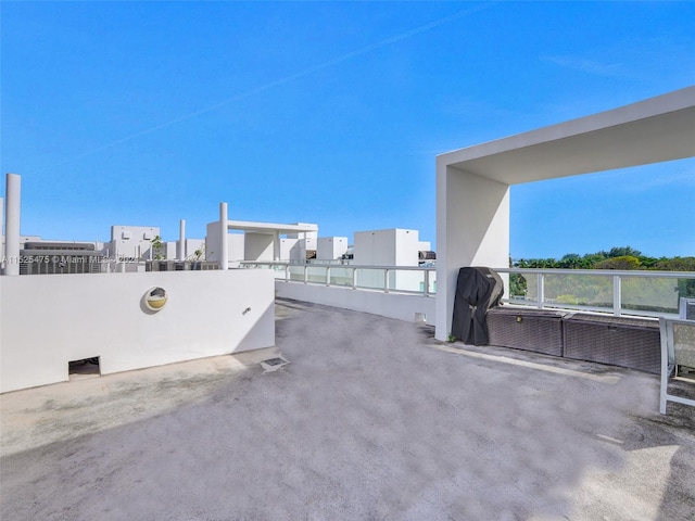 view of patio featuring a balcony