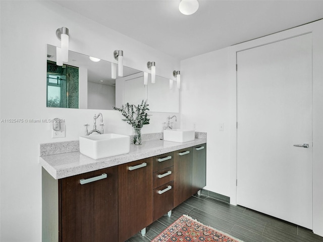 bathroom with vanity and hardwood / wood-style flooring