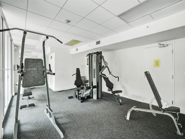 workout area featuring a drop ceiling