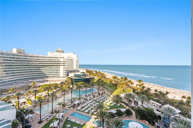 exterior space with a water view and a view of the beach