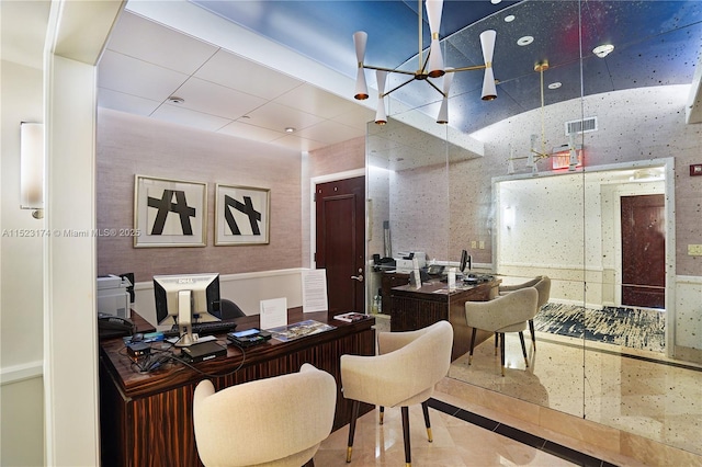 dining space with a raised ceiling and indoor bar