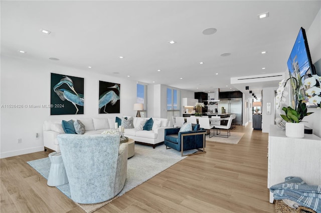 living room with light hardwood / wood-style flooring