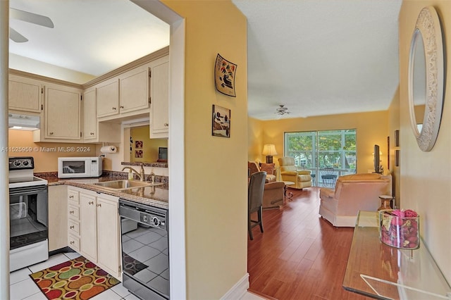 kitchen featuring extractor fan, ceiling fan, light wood-type flooring, range with electric cooktop, and dishwasher