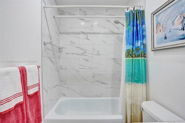 bathroom featuring toilet and shower / bathtub combination with curtain