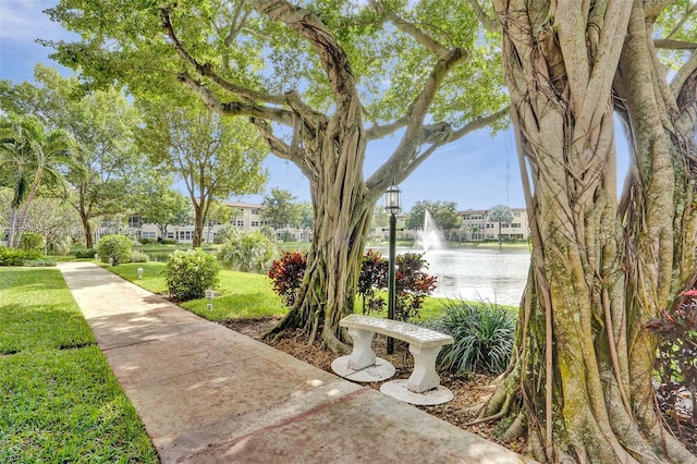 surrounding community featuring a water view