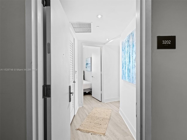 corridor featuring light hardwood / wood-style flooring