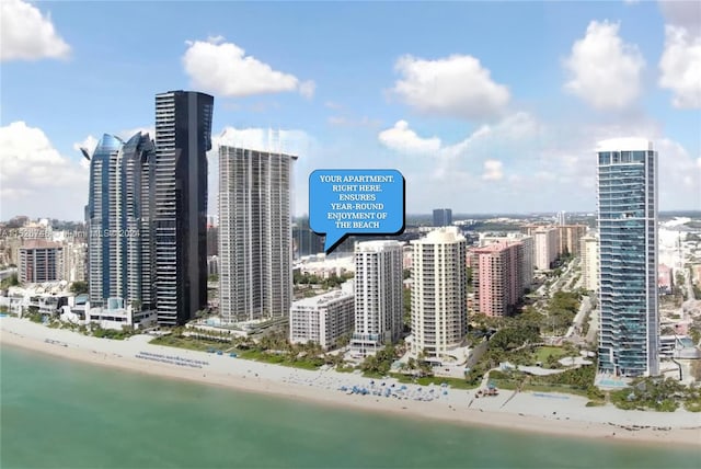 property's view of city with a water view and a view of the beach