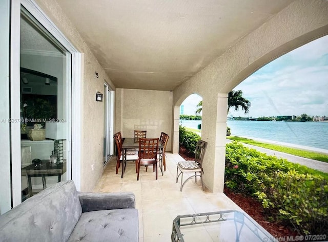 view of patio / terrace featuring a water view