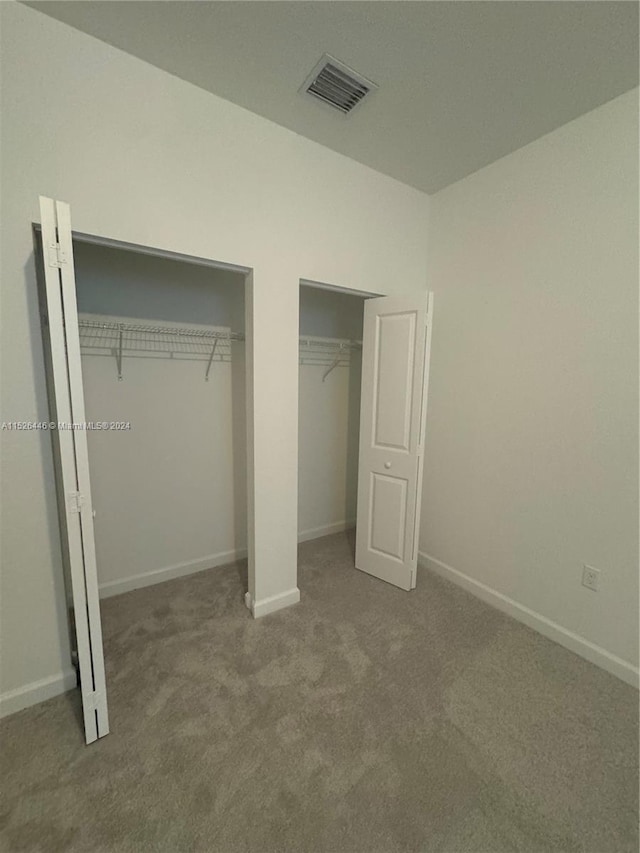 unfurnished bedroom with carpet floors