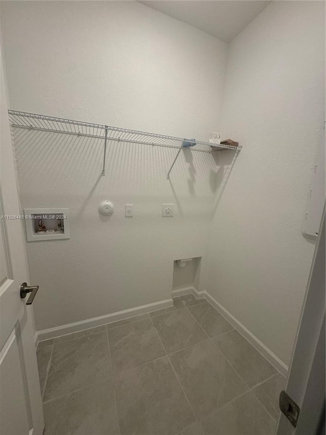 laundry area featuring tile patterned flooring, washer hookup, gas dryer hookup, and hookup for an electric dryer