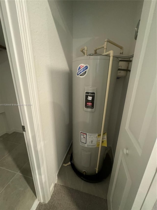 utility room with water heater