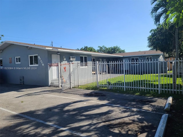 view of gate featuring a yard