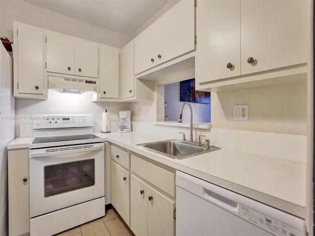 kitchen featuring sink, light tile patterned floors, and white appliances