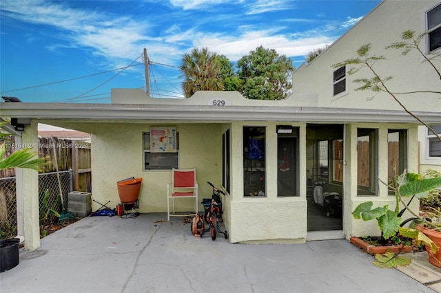 rear view of house featuring a patio