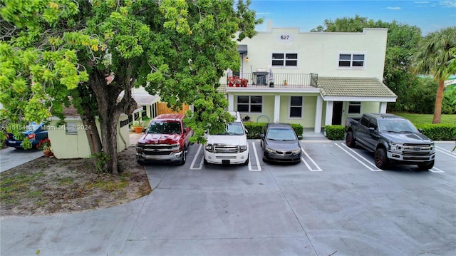 view of front of house with a balcony