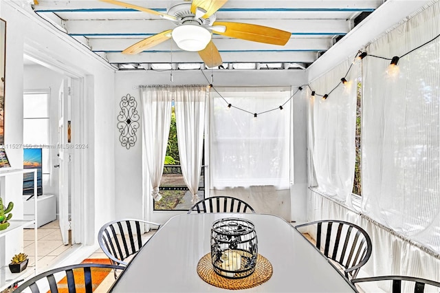 tiled dining area with ceiling fan