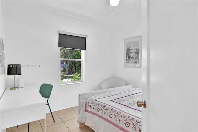 bedroom featuring light tile floors