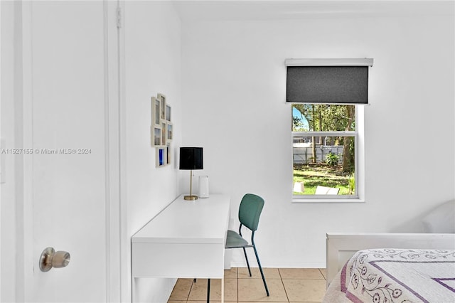 bedroom featuring light tile floors