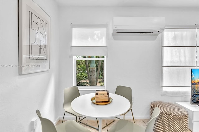 dining area with a wall mounted air conditioner