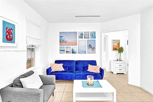 living room featuring light tile floors