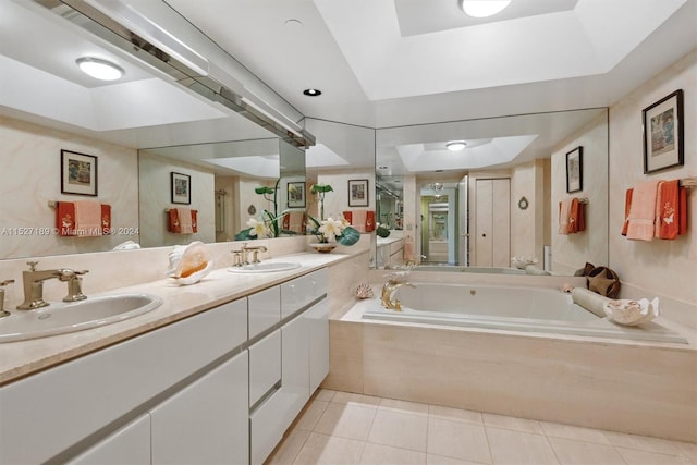 bathroom featuring tile floors, large vanity, a raised ceiling, and dual sinks