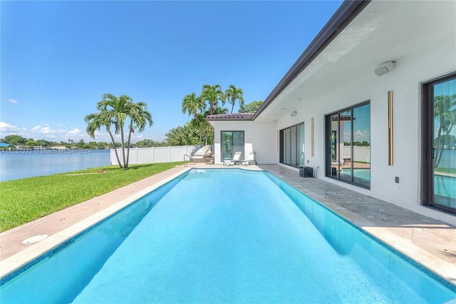 view of pool featuring a yard and a patio