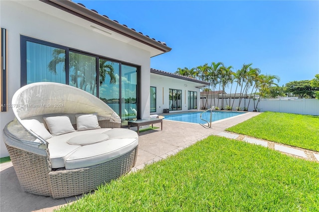 view of swimming pool with a lawn and a patio area