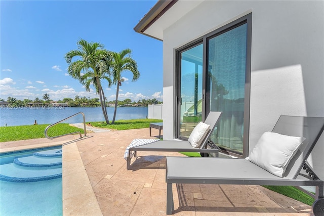 view of patio with a water view