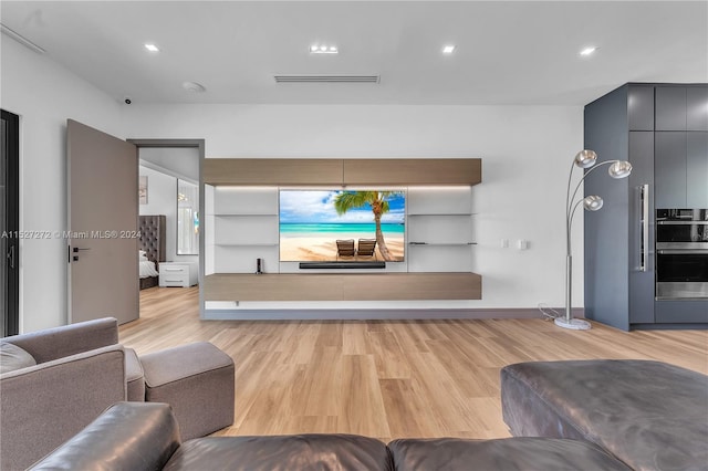 living room with light hardwood / wood-style flooring