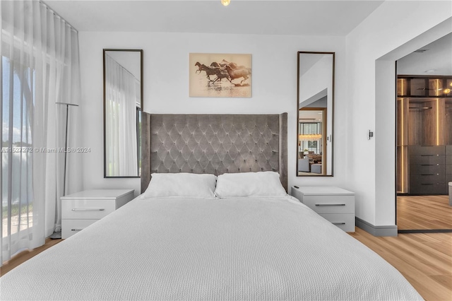 bedroom with light wood-type flooring