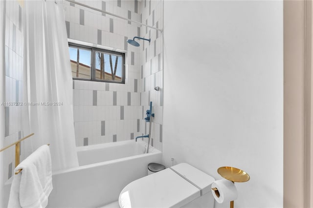 bathroom featuring toilet and shower / bathtub combination with curtain