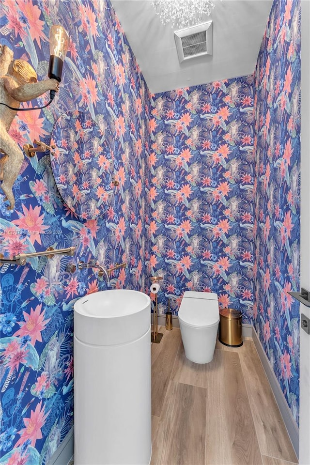 bathroom with wood-type flooring