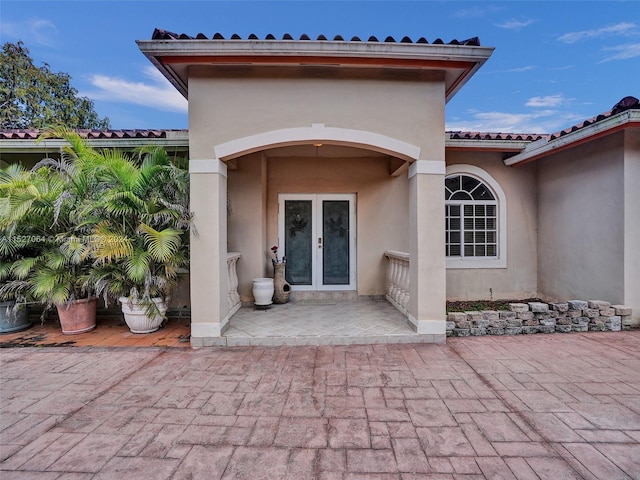 doorway to property featuring french doors