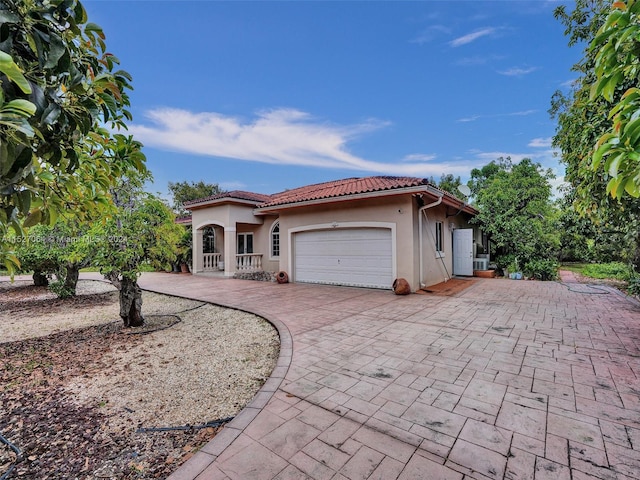 mediterranean / spanish-style house featuring a garage