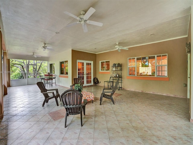 interior space featuring french doors and ceiling fan