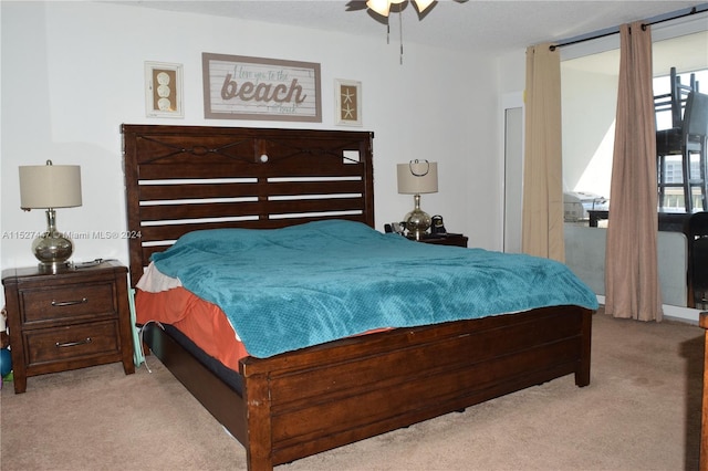 carpeted bedroom with ceiling fan