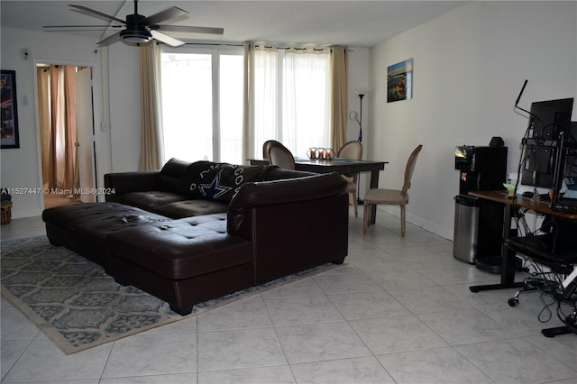 living room featuring light tile flooring and ceiling fan