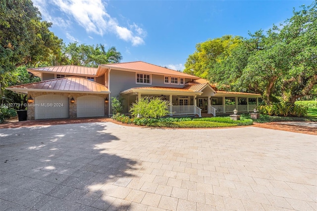 view of front of house with a porch and a garage