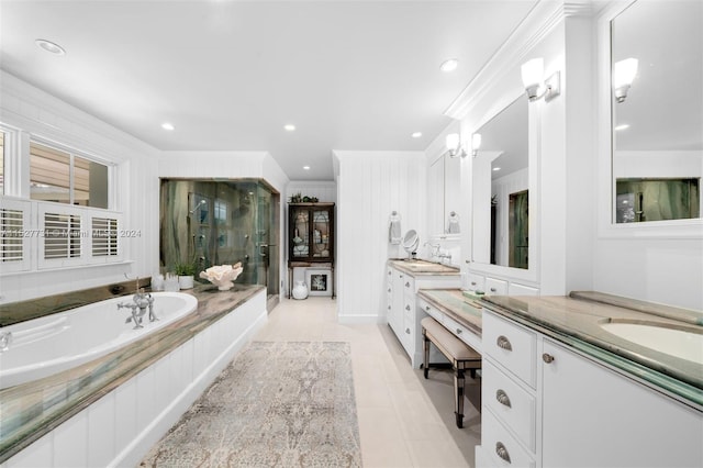 bathroom with vanity, tile patterned flooring, crown molding, and separate shower and tub