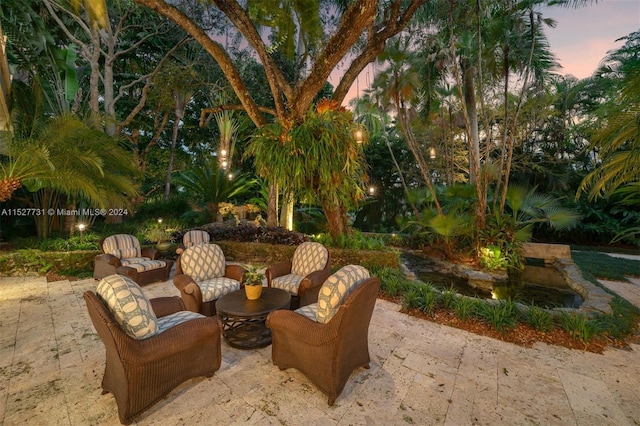 view of patio terrace at dusk