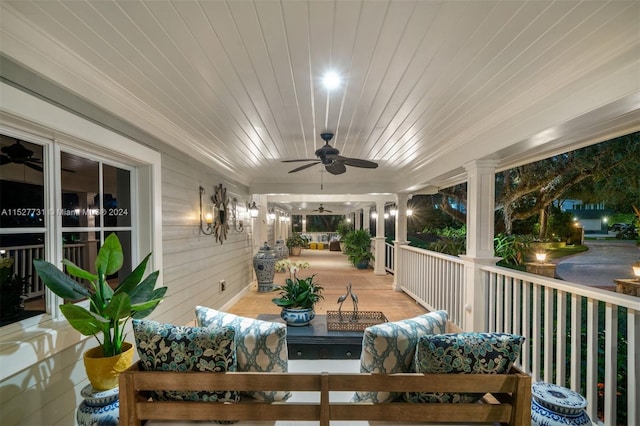 exterior space with an outdoor hangout area, ceiling fan, and covered porch